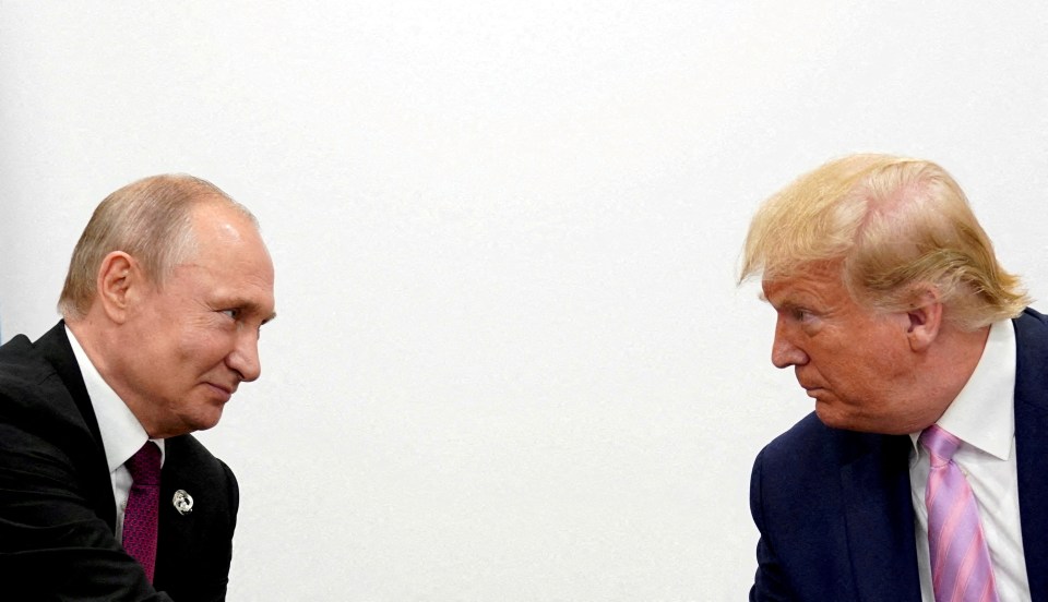 Photo of Vladimir Putin and Donald Trump in a bilateral meeting.