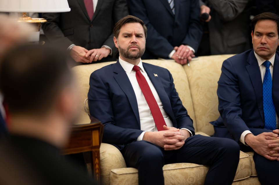 J.D. Vance seated during a meeting.