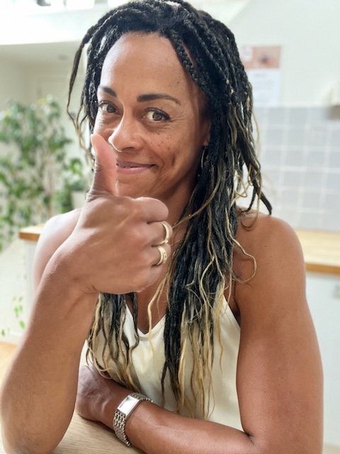 Woman giving thumbs up.