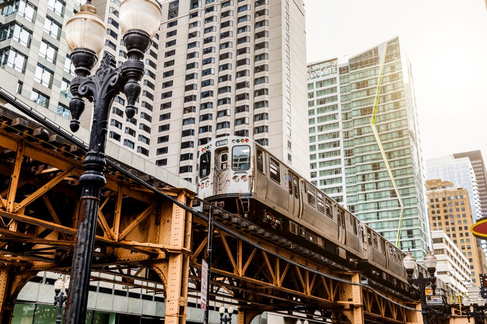 Elevated train passing skyscrapers in Chicago.