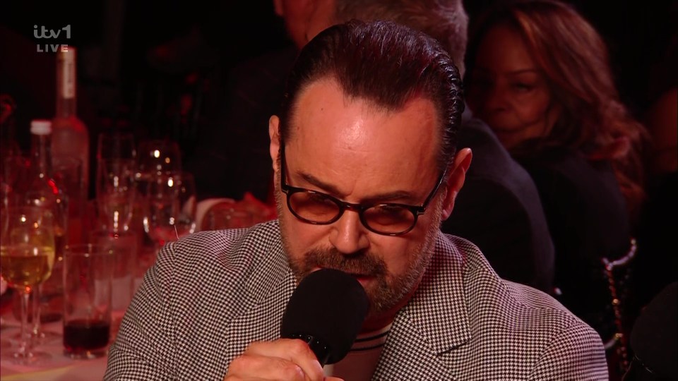 Danny Dyer speaking into a microphone.