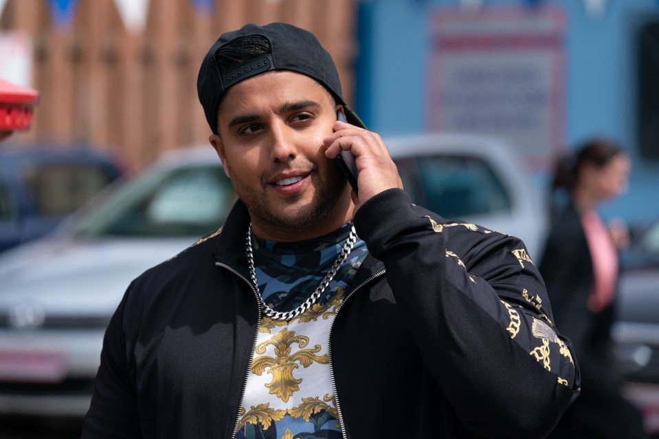 Amar Adatia as Jags Panesar on a phone call.