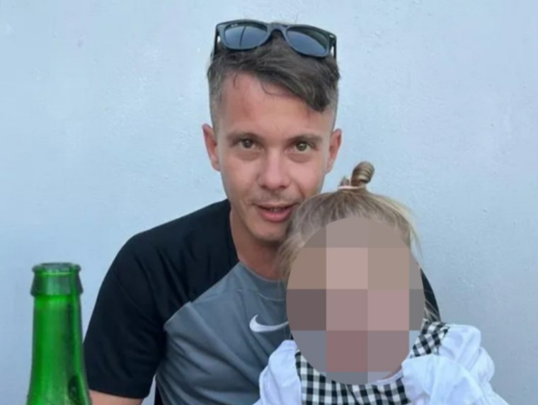 Man holding a young child.
