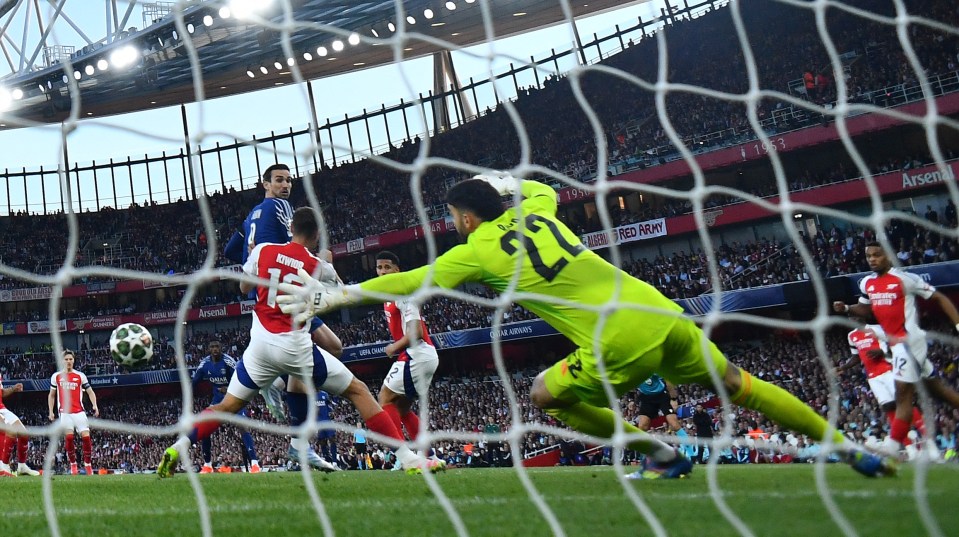 Soccer player scoring a goal.