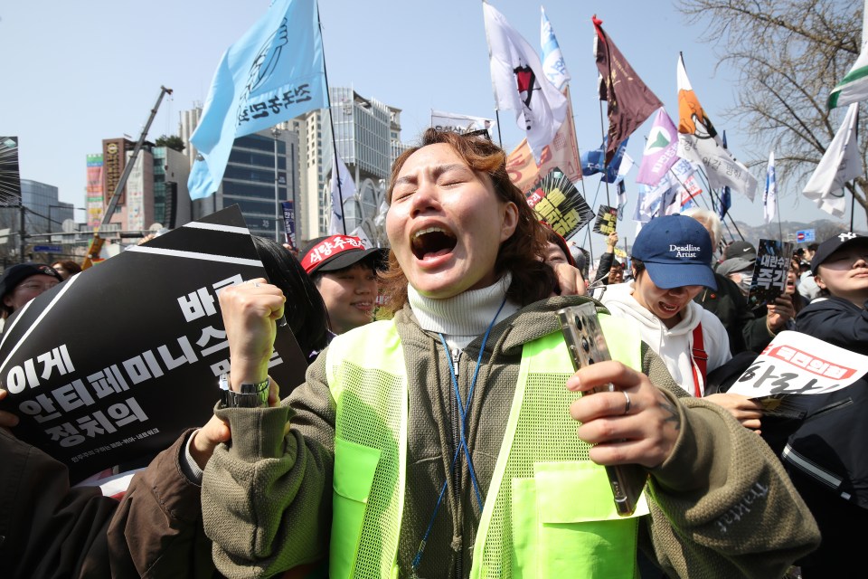 Protestors reacting to the impeachment of South Korean President Yoon Suk Yeol.
