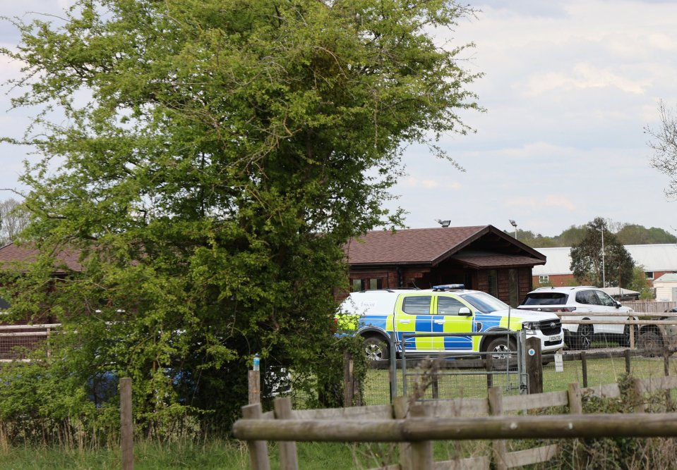 Police car parked outside a house following a fatal accident.