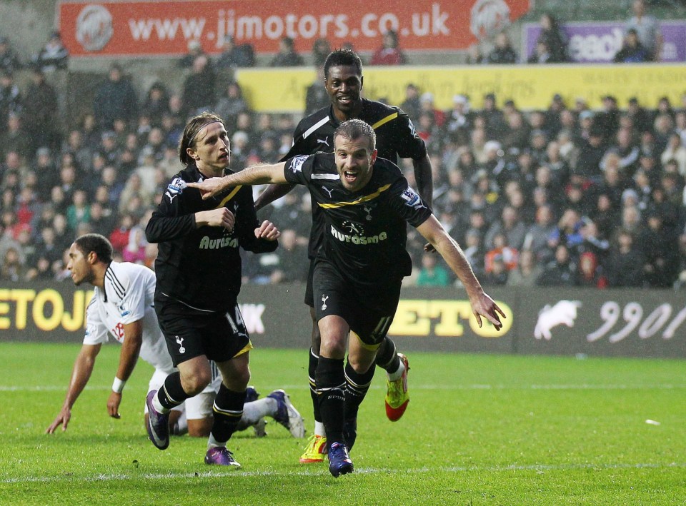 Soccer players celebrating a goal.