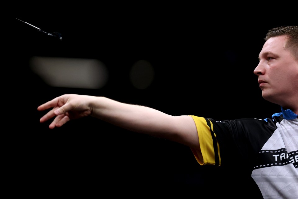 ROTTERDAM, NETHERLANDS - APRIL 17: Chris Dobey of England plays a shot in his match against Luke Humphries of England during the 2025 BetMGM Premier League Night 11 at Rotterdam Ahoy on April 17, 2025 in Rotterdam, Netherlands. (Photo by Dean Mouhtaropoulos/Getty Images)