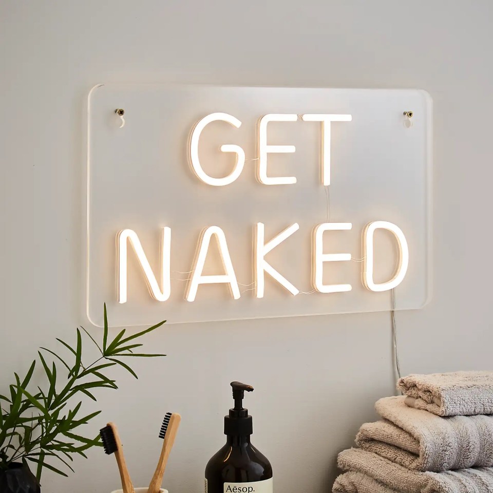 Neon sign that says "Get Naked"