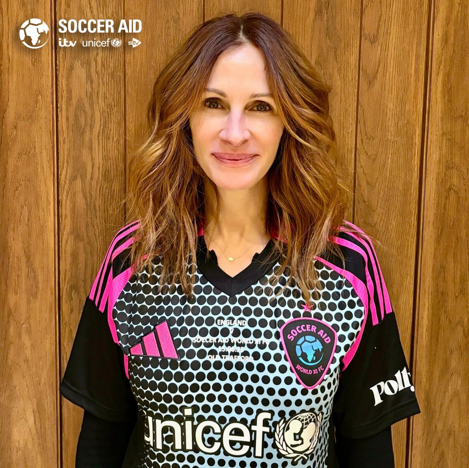 Julia Roberts wearing a Soccer Aid jersey.