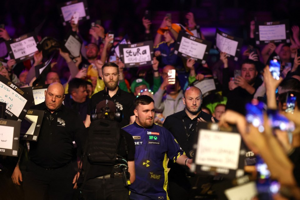 Darts - 2025 Premier League - Newcastle - Utilita Arena, Newcastle, Britain - March 27, 2025 Luke Littler during his walk on before his quarter final match against Stephen Bunting REUTERS/Lee Smith
