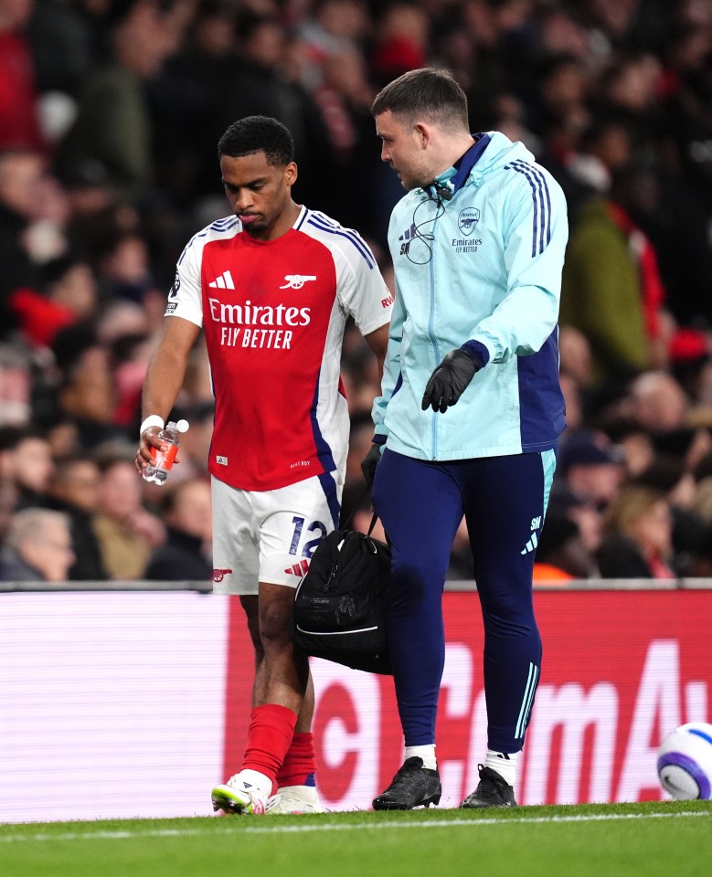 Arsenal's Jurrien Timber leaves the pitch with an injury.