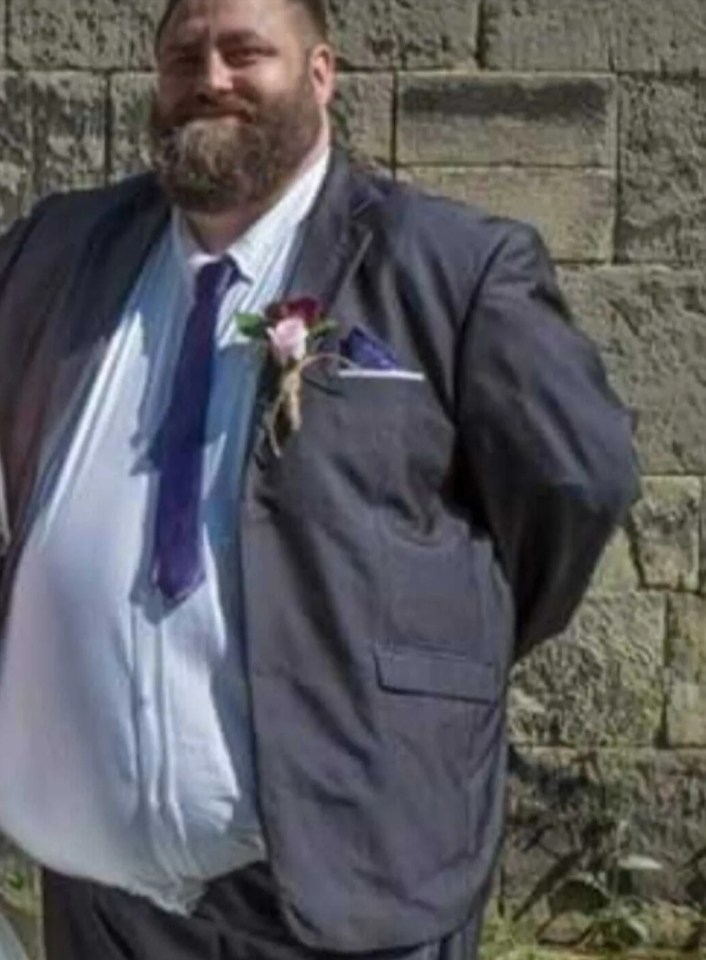 Man in suit weighing 406 lbs.
