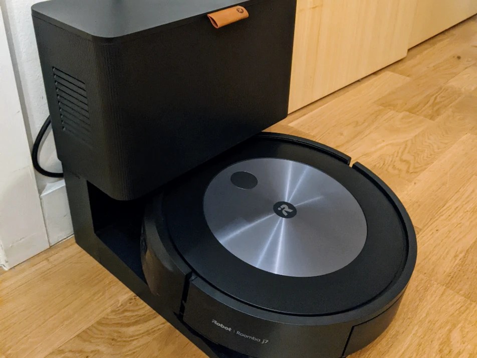 iRobot Roomba j7 robot vacuum cleaner in its charging dock.