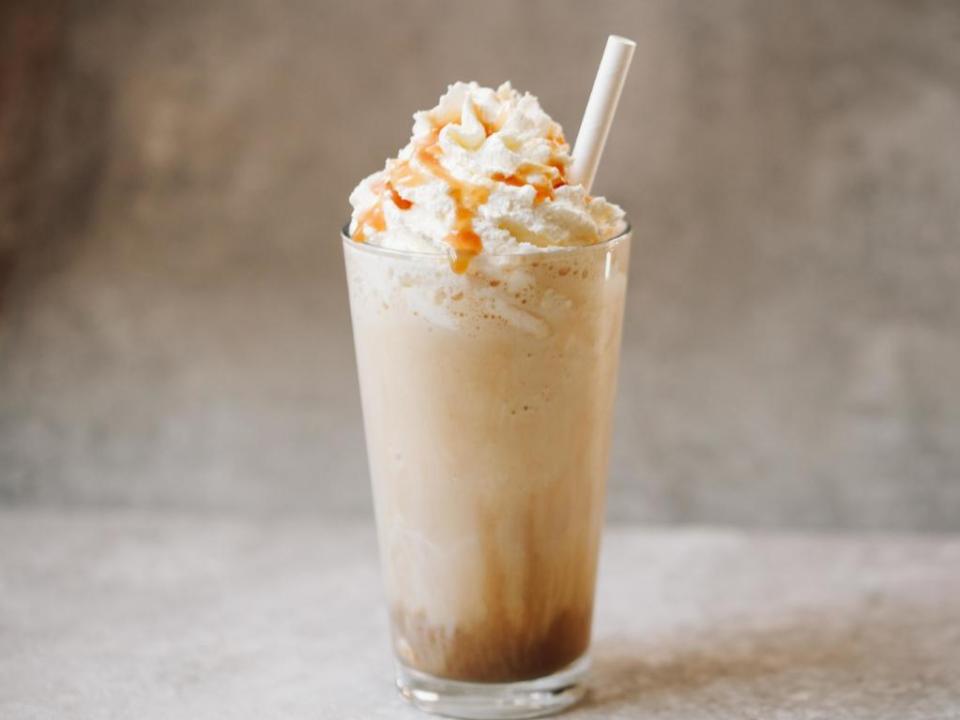 Caramel frappe with whipped cream.