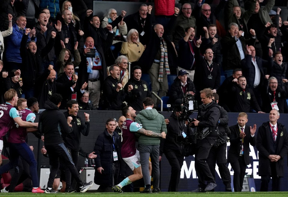 Burnley players and manager celebrating after a match.