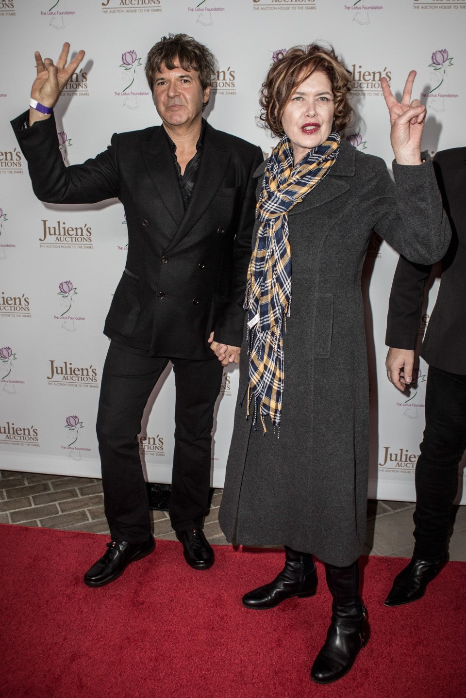 Clem Burke and Ellen Burke attending an auction.
