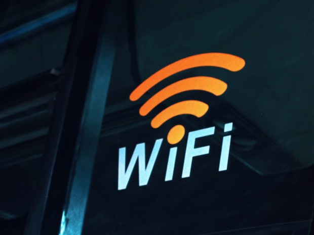 Wifi symbol and text on a dark surface.