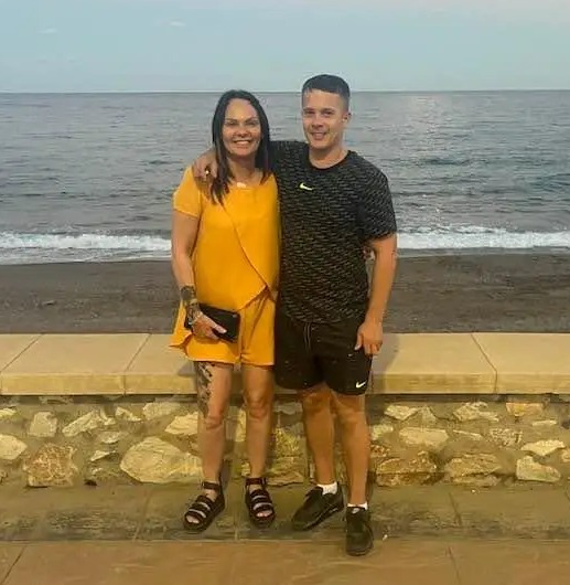Sandra Adams and Brett Dryden by the ocean.