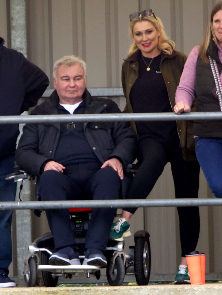 Eamon Holmes and Kate Alexandra at a football match.