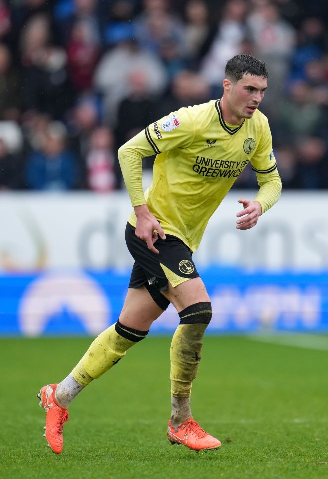 Lloyd Jones of Charlton Athletic running on a soccer field.