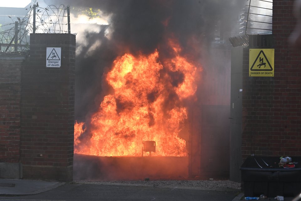 Firefighters battling a large fire at a power station.