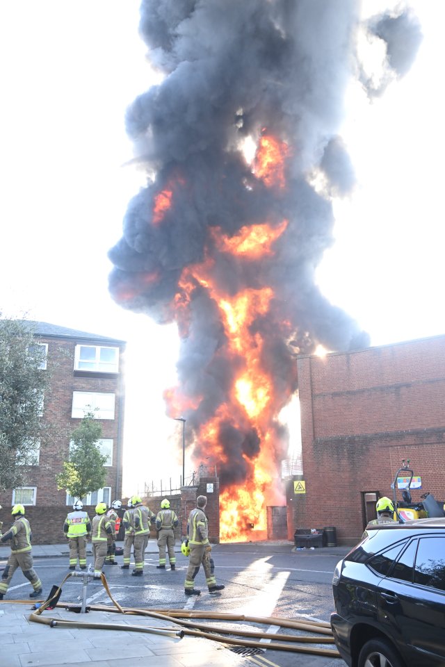 Firefighters battling a large fire at a power station.