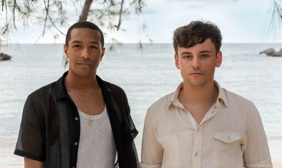 Portrait of Michael Gunning and Tom Daley on a beach.