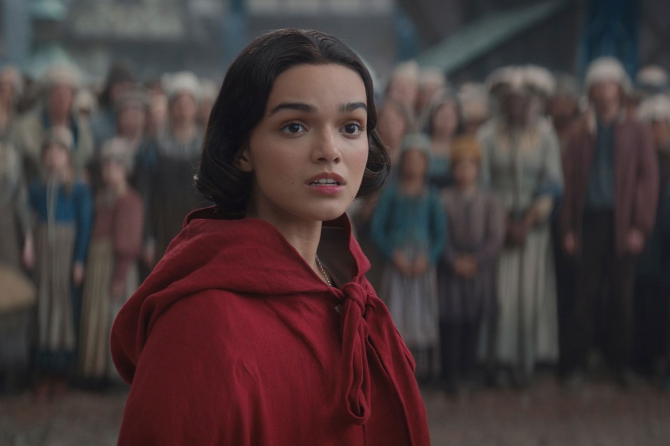 Rachel Zegler in a red hooded cloak in a scene from "Snow White."