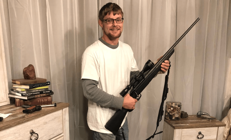 Man holding a rifle.