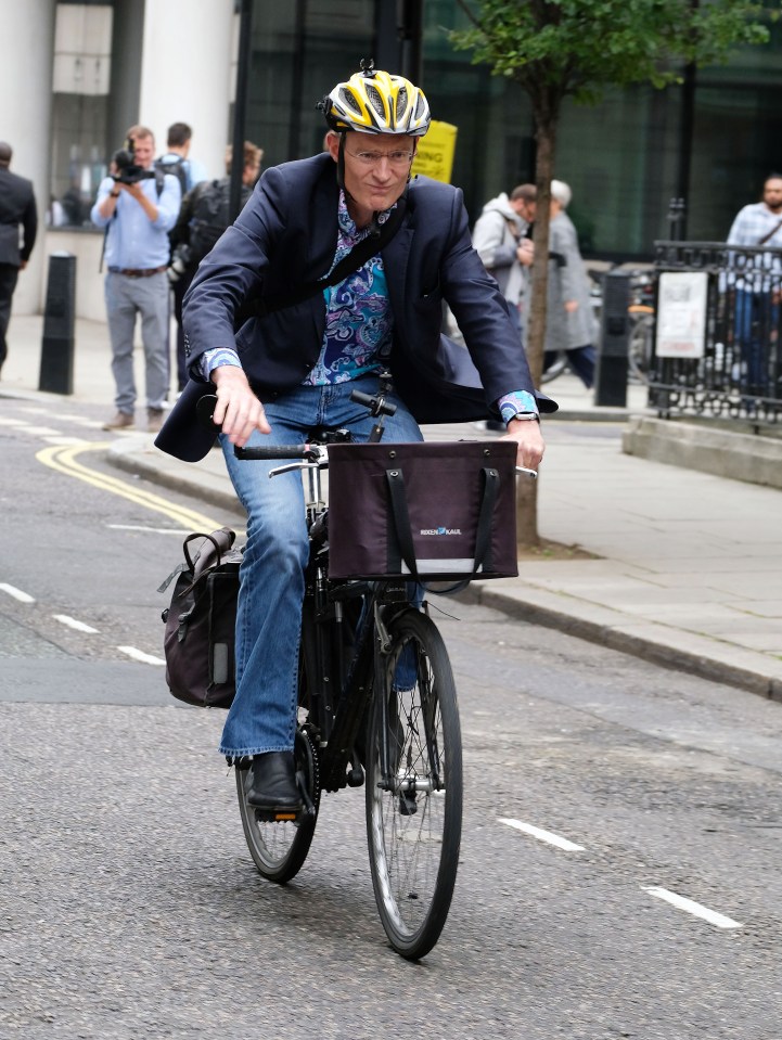 Jeremy Vine cycling away from the BBC Wogan house.