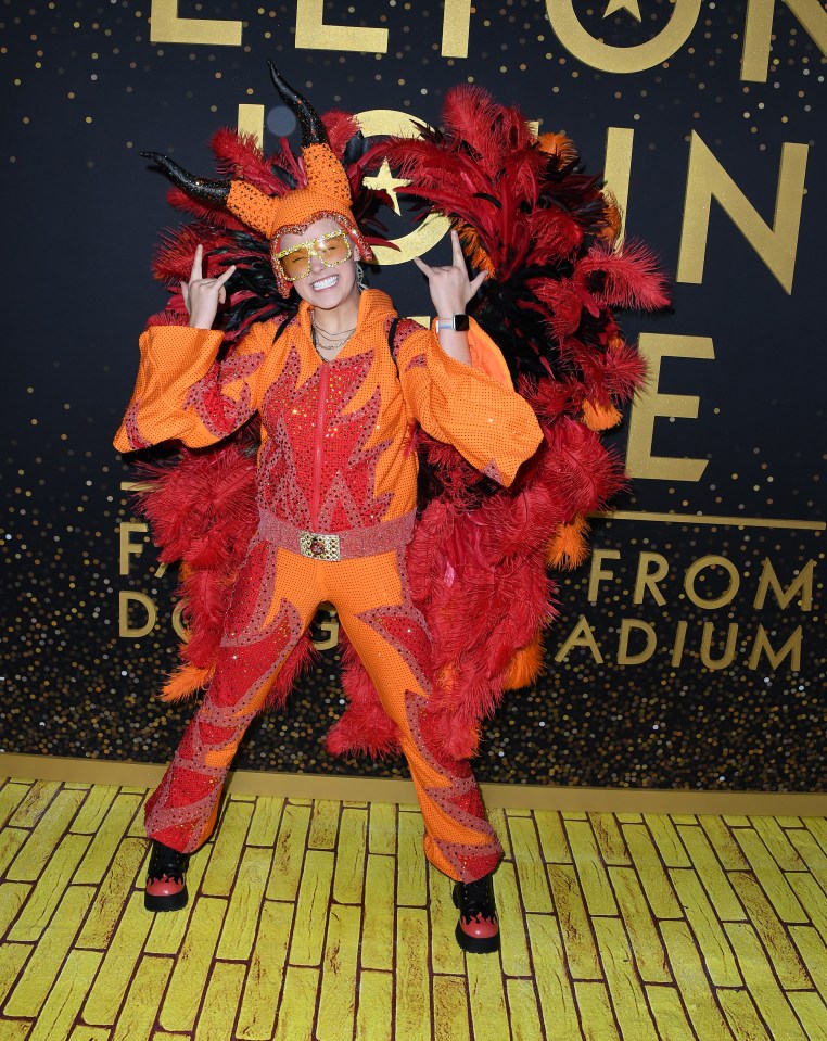 JoJo Siwa in a flame-themed costume at a Disney+ event.