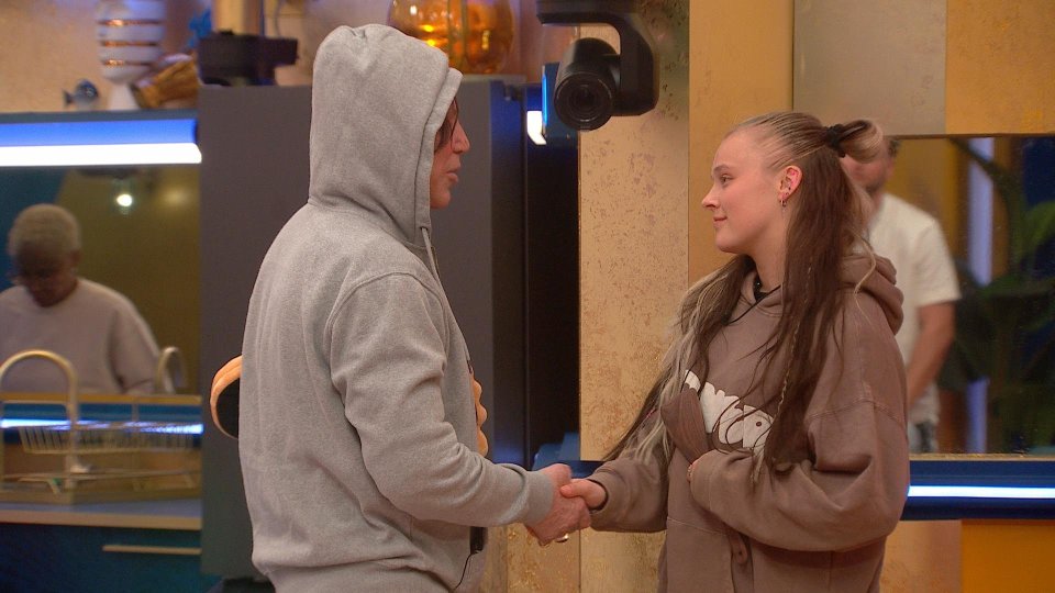 JoJo Siwa and Mickey Rourke shaking hands on Celebrity Big Brother.