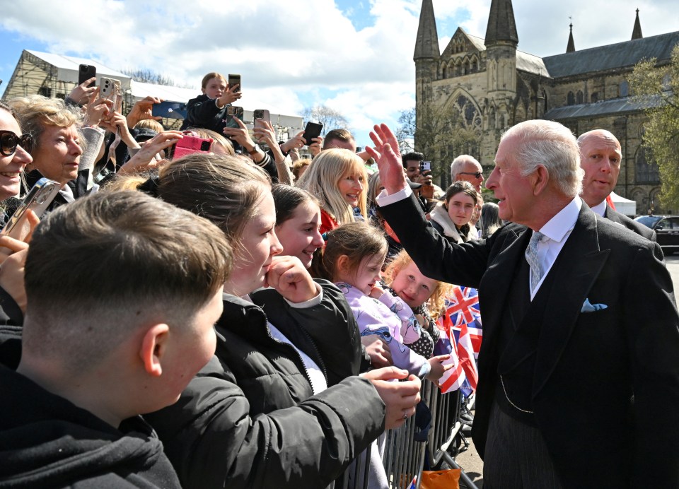 King Charles III greets well-wishers.