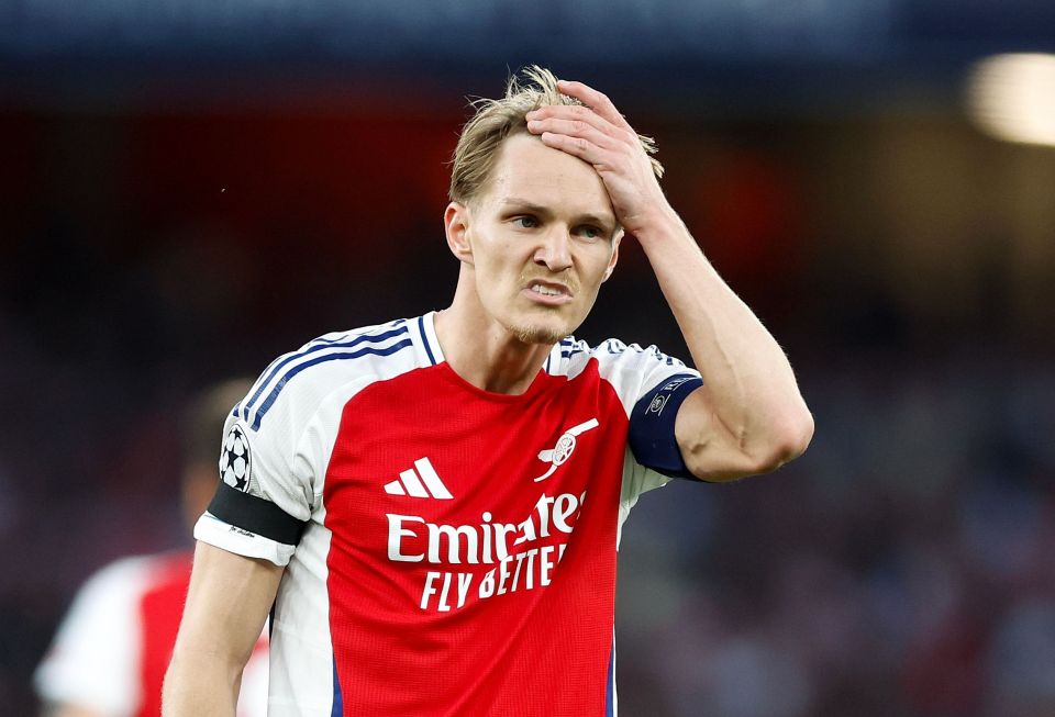Martin Odegaard of Arsenal looking distressed during a game.