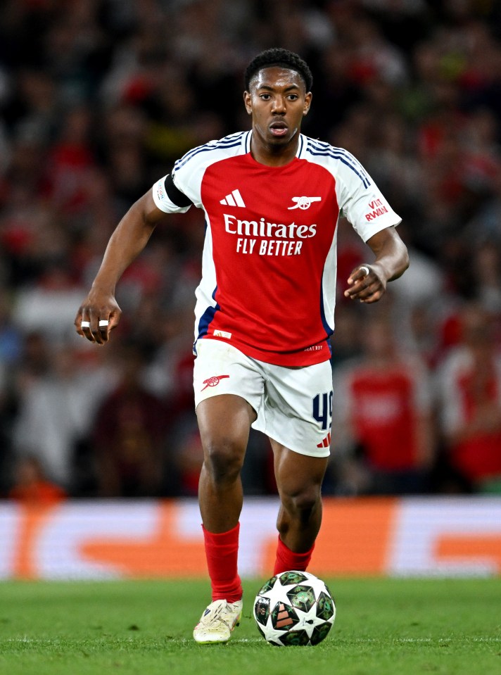 Myles Lewis-Skelly of Arsenal running with the ball during a soccer match.