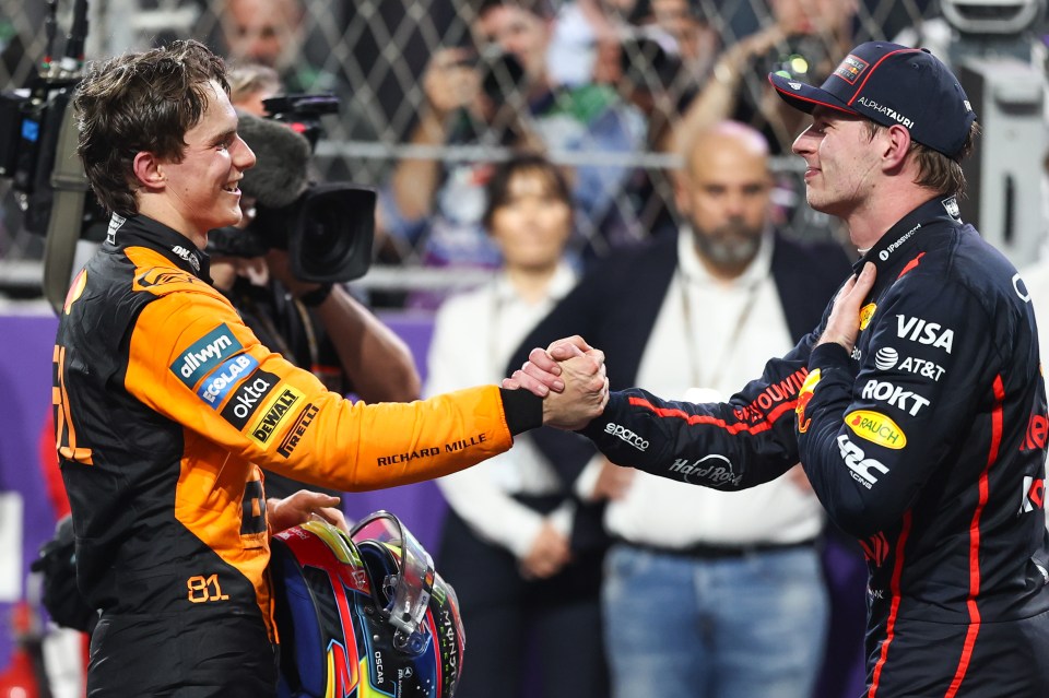 Oscar Piastri and Max Verstappen shaking hands after a Formula 1 race.