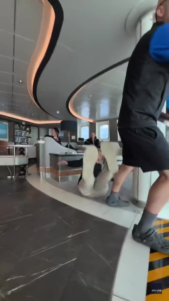 Passengers thrown to the floor of a cruise ship lounge during rough seas.