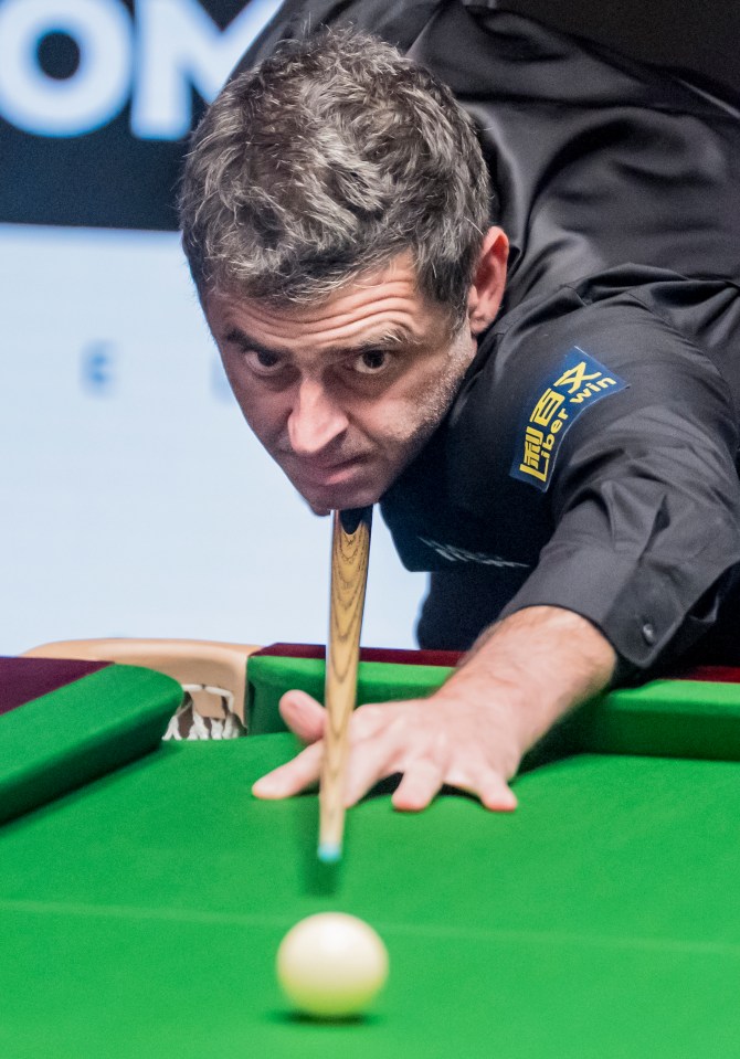 Ronnie O'Sullivan playing snooker.