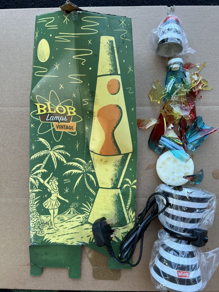 Damaged lava lamp and its packaging.