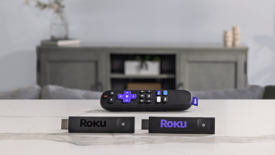 Two Roku streaming sticks and a remote.