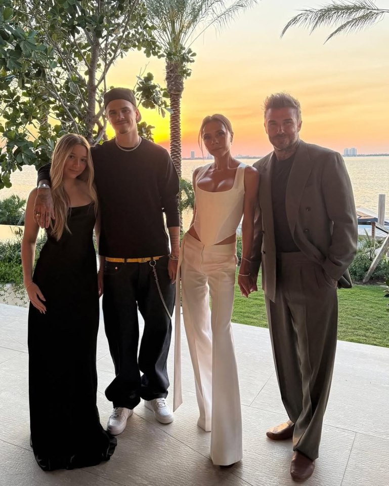 Victoria and David Beckham with their children at sunset.