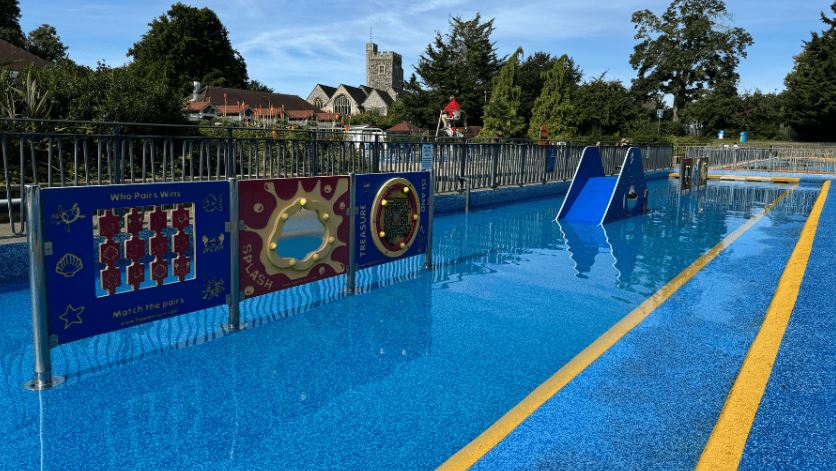 Guildford Lido play area with a small pool and interactive water features.