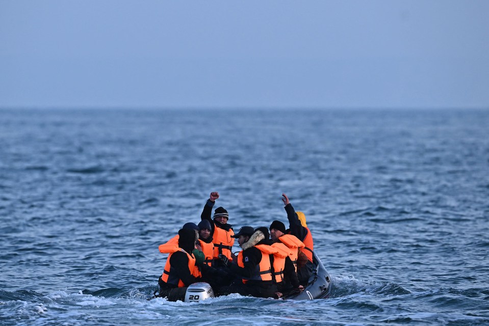 Migrants arriving at a port on a Border Force boat.