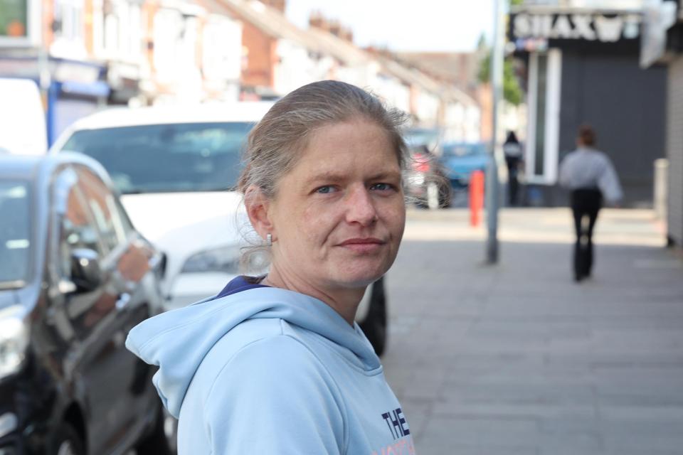 Woman standing on a street in Middlesbrough.