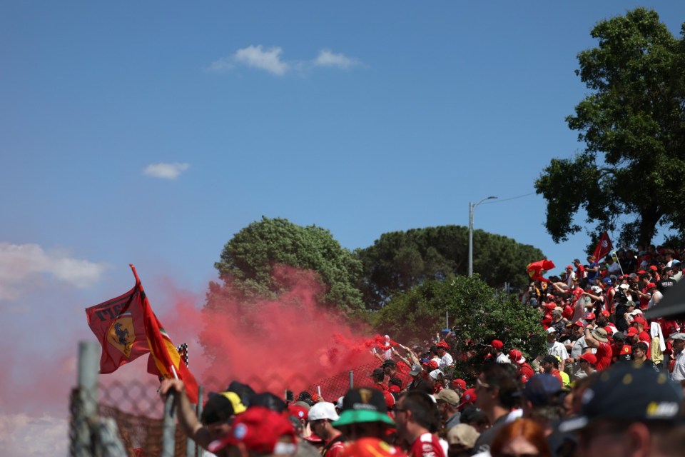 IMOLA, ITALY - MAY 18: A red smoke flare is fired in the crowd during the F1 Grand Prix of Emilia-Romagna at Autodromo Internazionale Enzo e Dino Ferrari on May 18, 2025 in Imola, Italy. (Photo by Ryan Pierse/Getty Images)