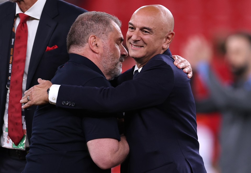 Daniel Levy and Ange Postecoglou embracing after a soccer match.