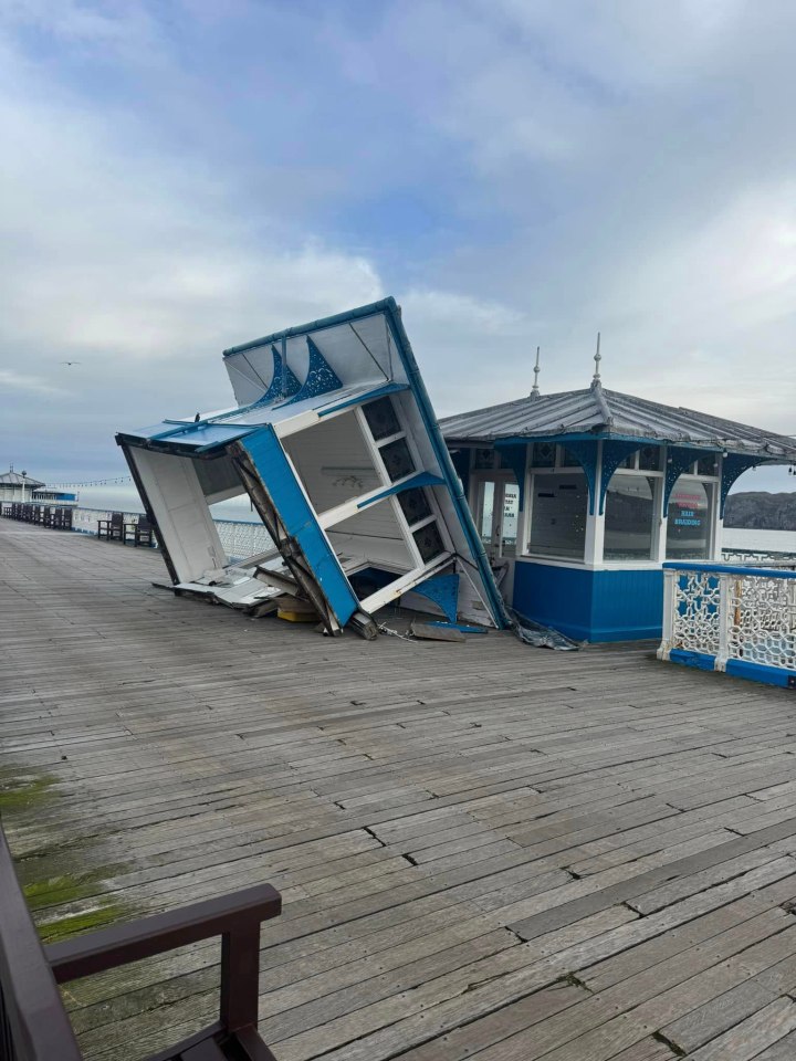 An historic pier ravaged by 93mph winds last winter has stormed back on top - to be named the UK's Pier of the Year. The stunning Llandudno Pier won the prestigious title after battled back from the damage inflicted by Storm Darragh in December. The North Wales seaside resort beat off towns across Britain to take top spot in the awards for the first time in 20 years. The pier was closed for months after damage in Storm Darragh - with a hut blown across the boardwalk and slate roofs and shacks destroyed. National Piers Society chairman Tim Wardley said: "Llandudno Pier has suffered a torrid time with the storm damage inflicted over the winter and our members were highly impressed with the way the pier owners, staff and public all pulled together to ensure repairs were carried out in record time to get the pier re-opened. Pictured here is the damaged pier after Storm Darragh. WALES NEWS SERVICE