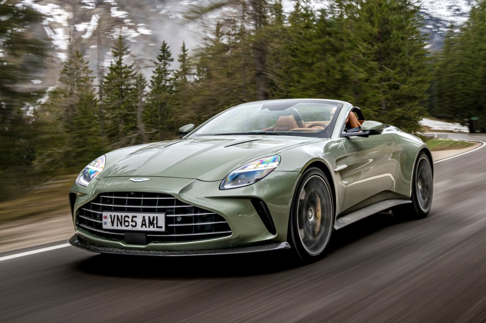 Aston Martin Vanta driving on a mountain road.