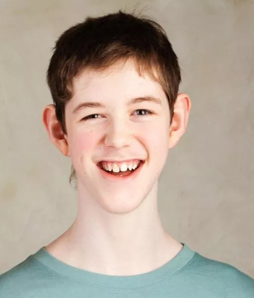 Photo of a smiling teenage boy.